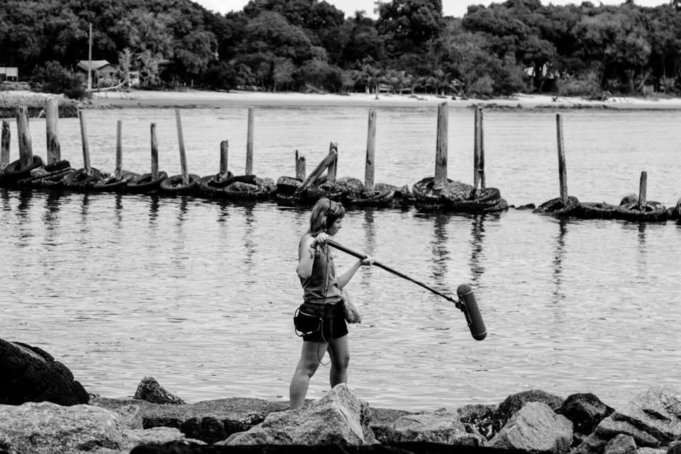 Ana Chiossi boom operating on location by the water